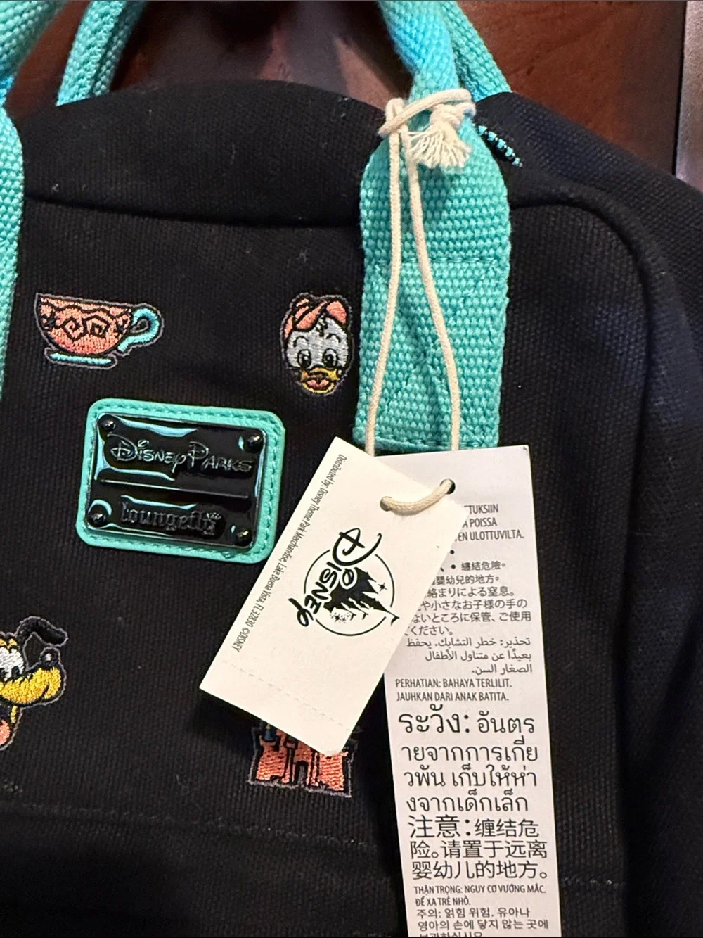 Loungefly Black Mini Backpack with Teal Handles and Straps